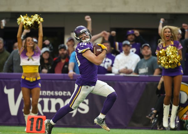 Vikings receiver Adam Thielen looked back and smiled as he headed for the end zone on a 65-yard pass play for a fourth quarter touchdown.