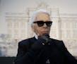 FILE - In this Monday, Jan. 28, 2013 file photo, Karl Lagerfeld poses for photographers prior to the start of a press conference, in Rome. Chanel's ic