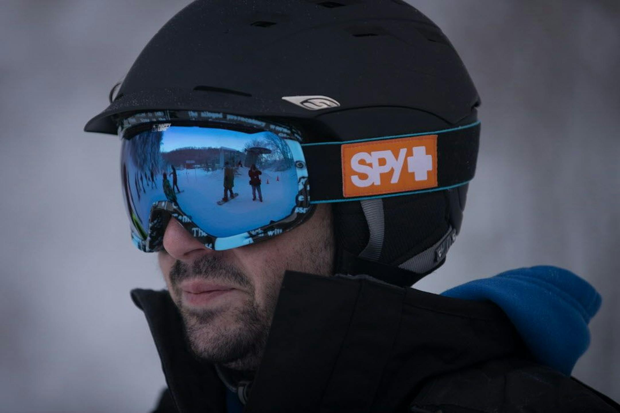 Joel Vertelney (cq), a terrain park tester and attendeant at Afton Alps, watches as snowboarders test out some of his obstacles for the first time this season.