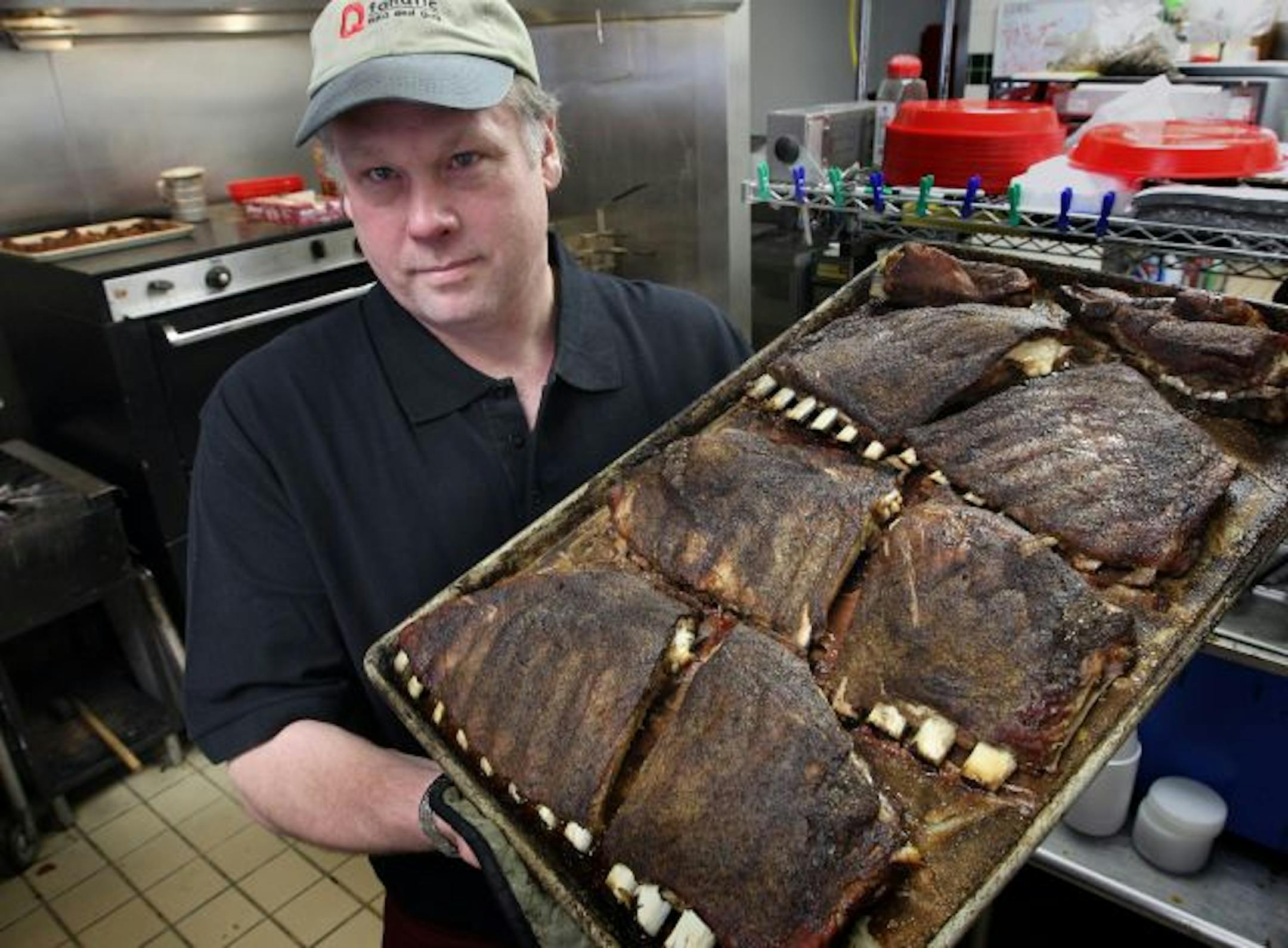 Q Fanatic's owner, Charlie Johnson, with his dry-rubbed ribs.