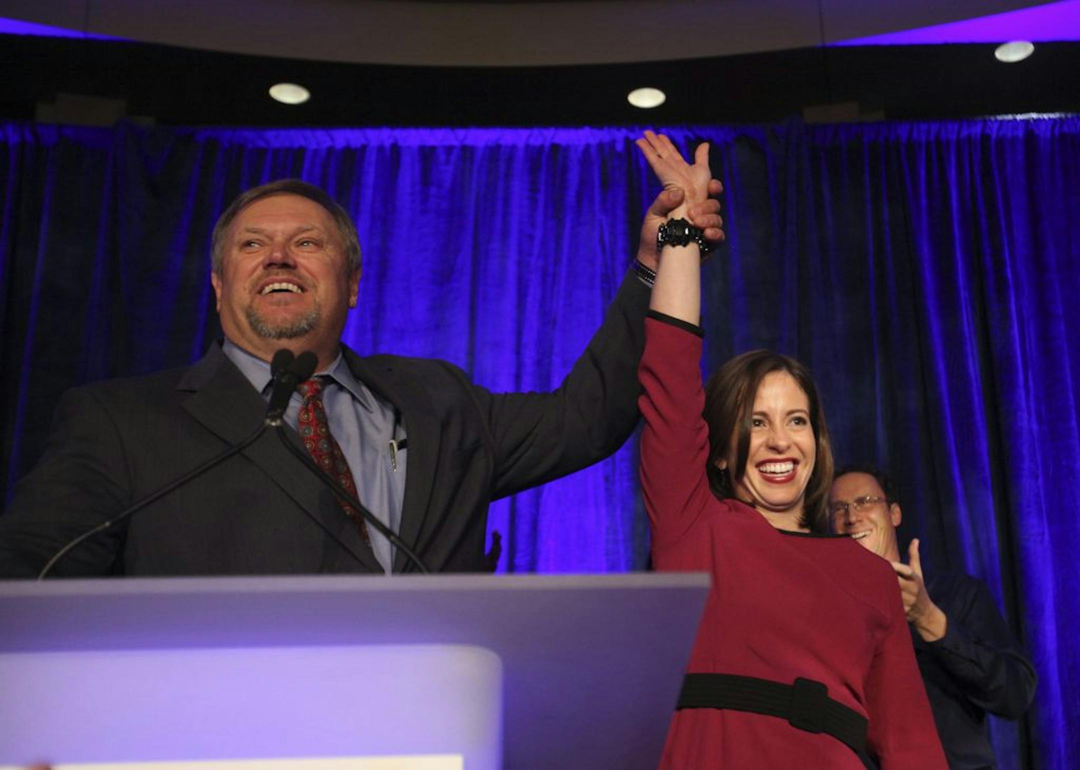 The Senate's new majority leader, Tom Bakk of Cook, raised the hand of Melisa Franzen as he introduced the newly elected state senator from Edina who will join him in the DFL controlled Senate.