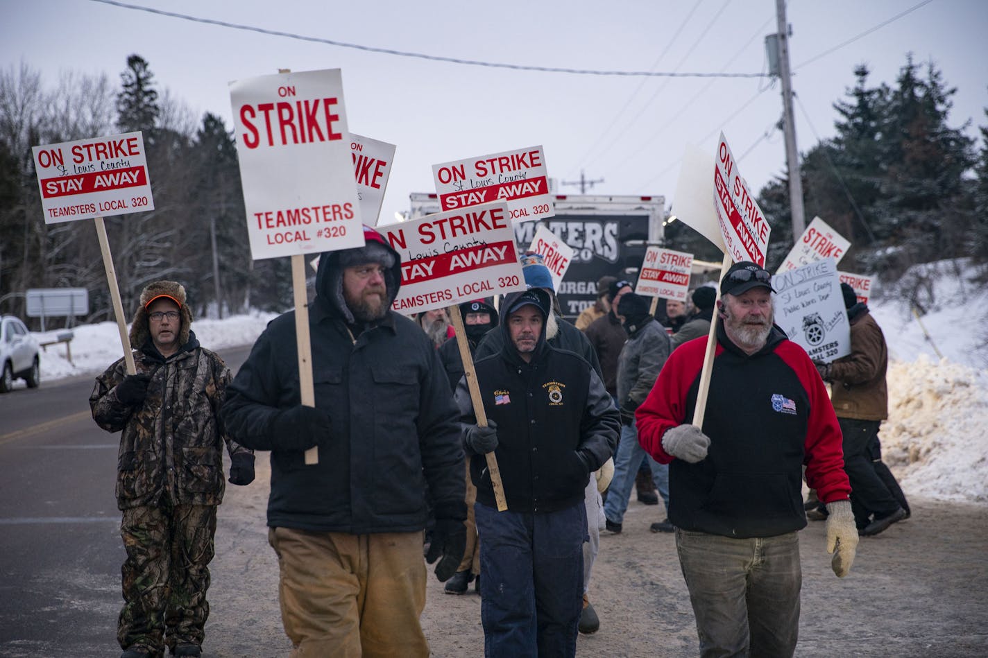 Snow plow driver picketers on strike marched in front of the St. Louis County Public Works Department building in Pike Lake, MN on January 15, 2020. ]
ALEX KORMANN &#x2022; alex.kormann@startribune.com St. Louis County snow plow drivers went on strike starting on January 15, 2020. Picketers gathered at St. Louis County Public Works Department building in Pike Lake, MN starting around 7AM.