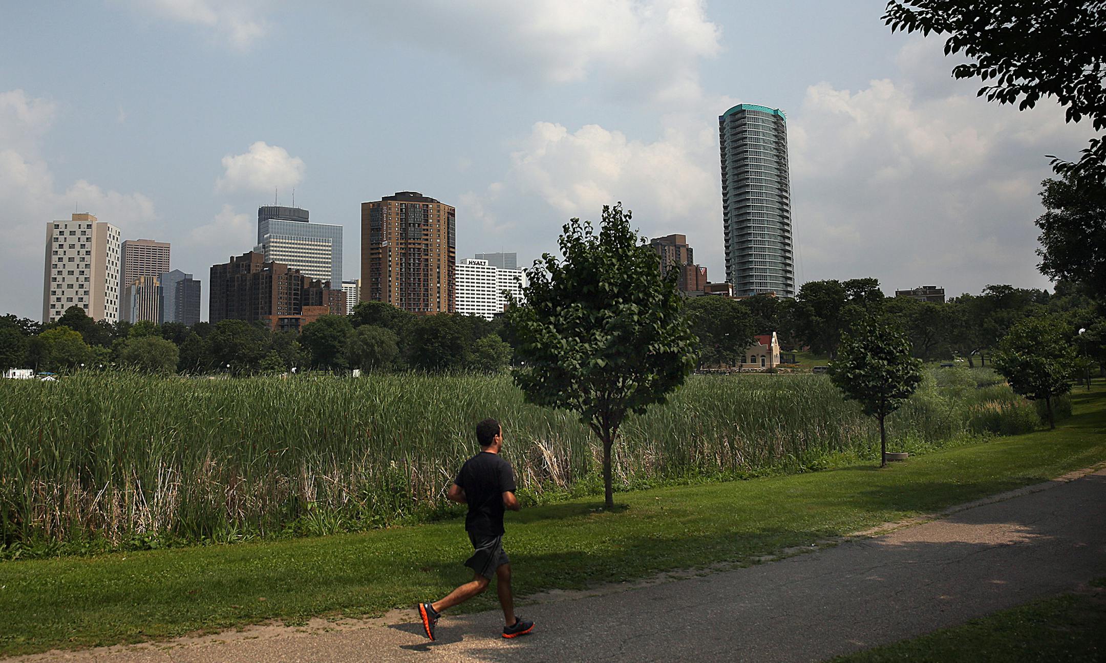 The 36-story Loring Park apartment building (right) has 354 units including studios, one and two-bedroom apartments, a fitness center, indoor hot tub, sauna and steam rooms and many other amenities.] JIM GEHRZ &#x201a;&#xc4;&#xa2; jgehrz@startribune.com / Minneapolis, MN / August 1, 2014 / 1:00 PM