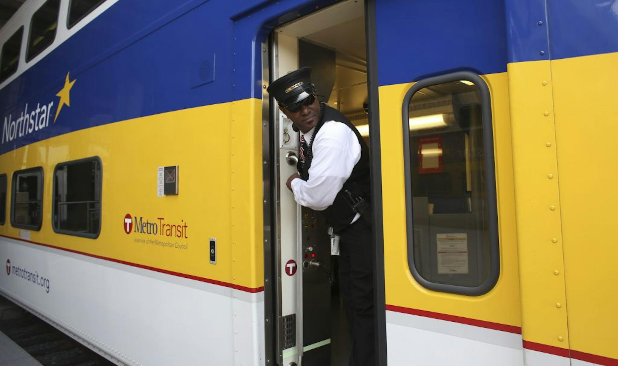 Conductor Vincent Roberts checked before closing the doors on the northbound train leaving the Target Field station Tuesday. A fare reduction on the line will run from Aug. 1 through April.