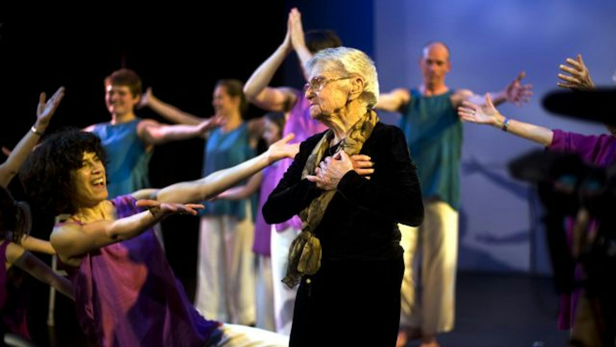 Ida Arbeit, 100, joined in the movement with Maria Genné, director of the intergenerational Kairos Dance group. "You feel that beat?" Arbeit called out during rehearsal for Sunday's celebration.