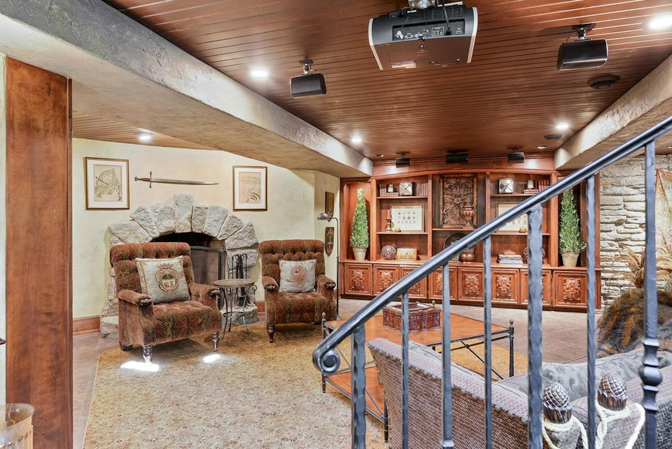 the lower level now includes custom built-ins and a fireplace. There's also a sauna and wine cellar.