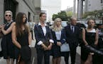 Attorney David Boies (Right) walks with some of Jeffrey Epstein's alleged sexual abuse victims, inlcuding Virginia Roberts Giuffre (Left of Boies) as 