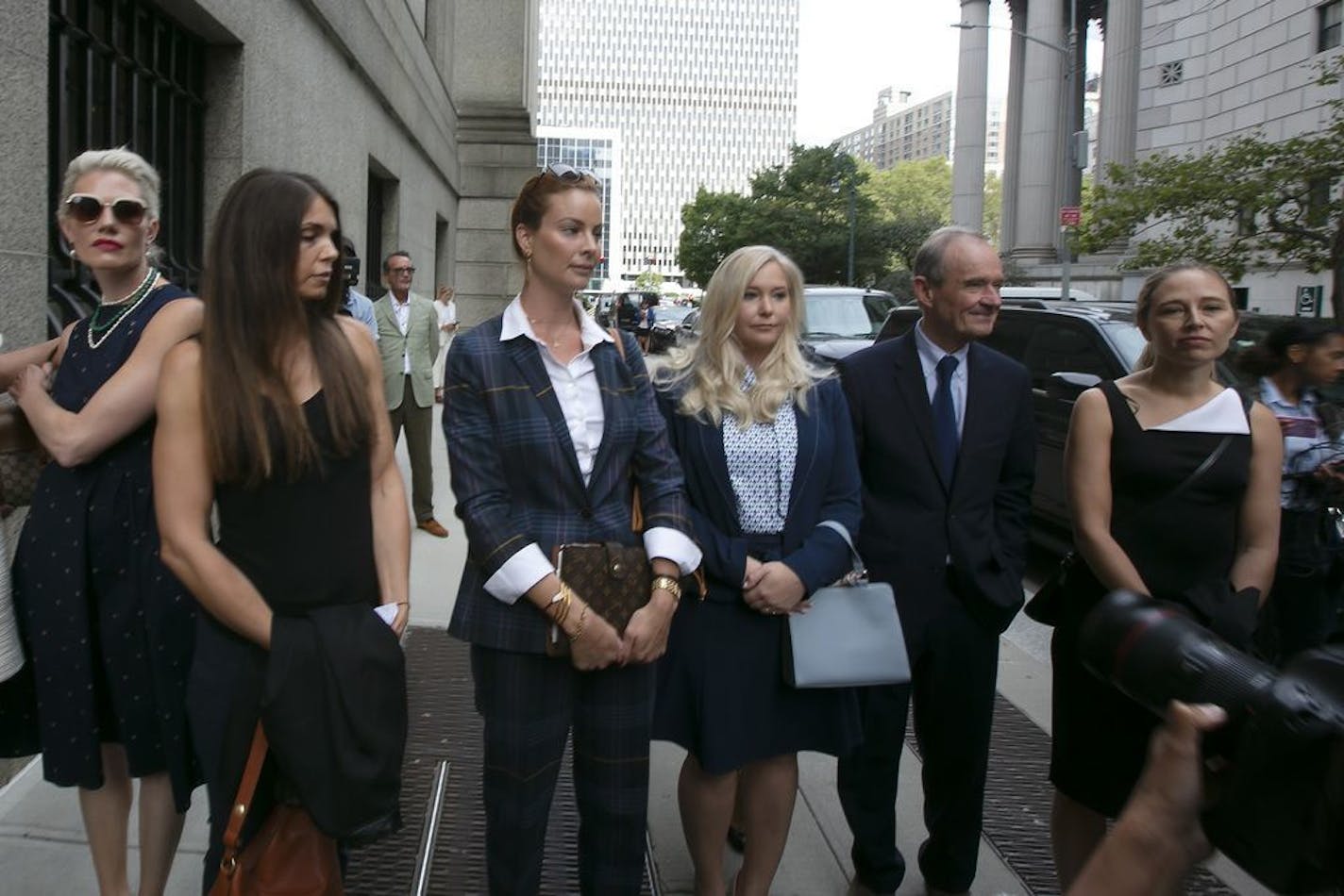 Attorney David Boies (Right) walks with some of Jeffrey Epstein's alleged sexual abuse victims, inlcuding Virginia Roberts Giuffre (Left of Boies) as they enter the Thurgood Marshall US Courthouse Tuesday, Aug. 27, 2019 for a special hearing.