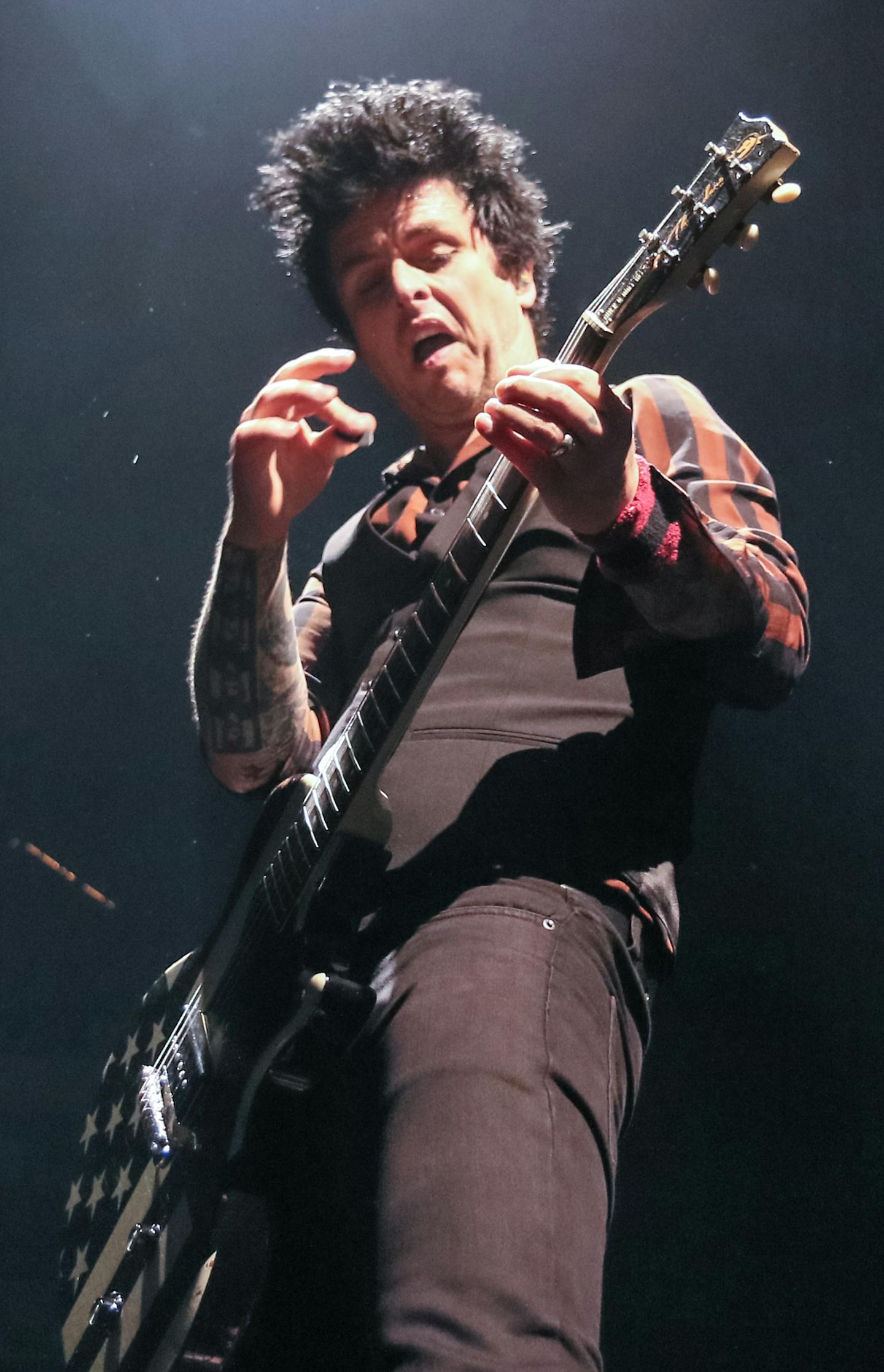 Green Day vocalist Billie Joe Armstrong jams on his guitar at the Xcel Energy Center Saturday night. Photo By: Matt Weber