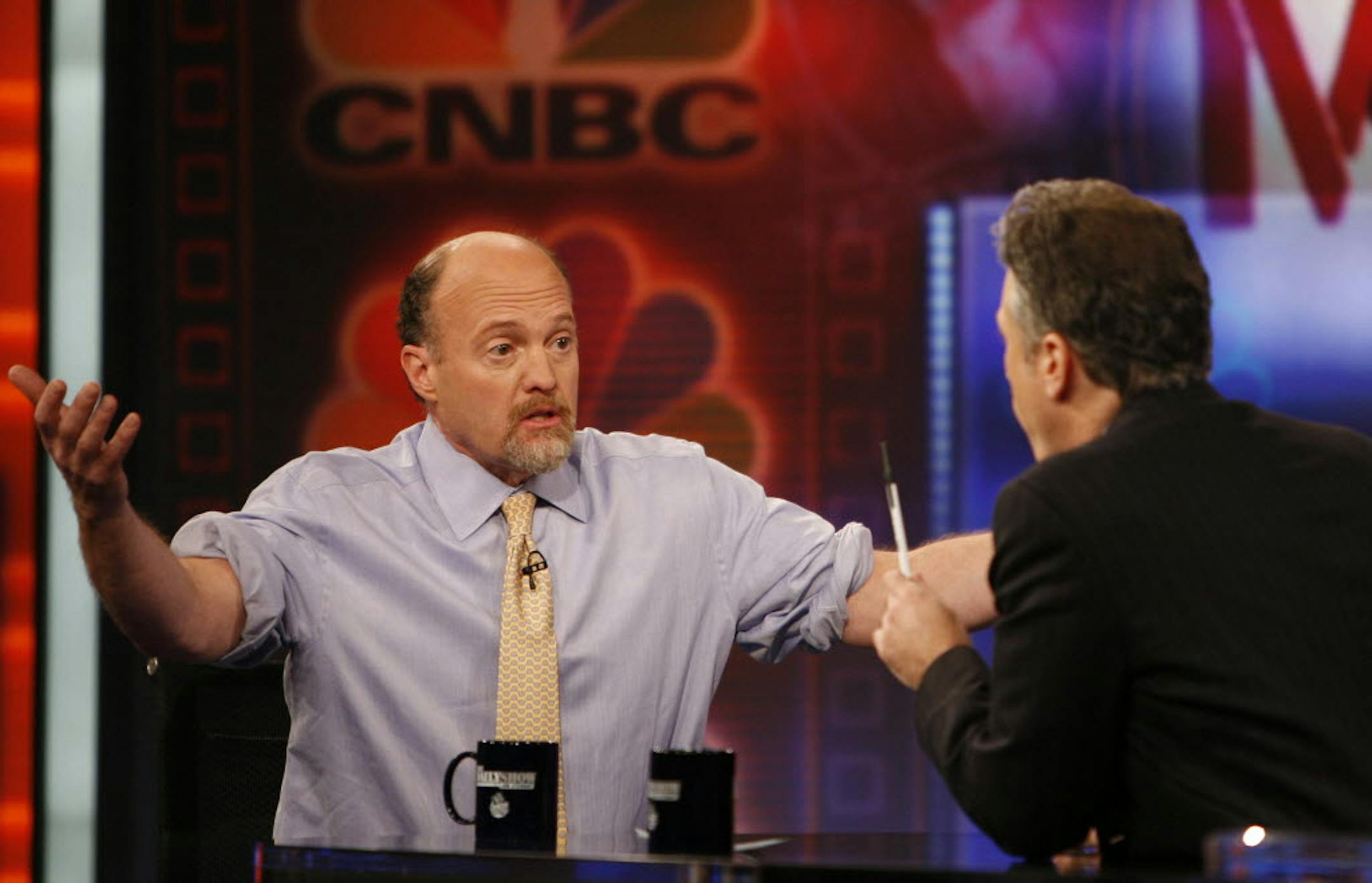 Jim Cramer, left, host of "Mad Money" on CNBC, makes a point as he talks with Jon Stewart during an appearance on Comedy Central's "The Daily Show with Jon Stewart" Thursday.