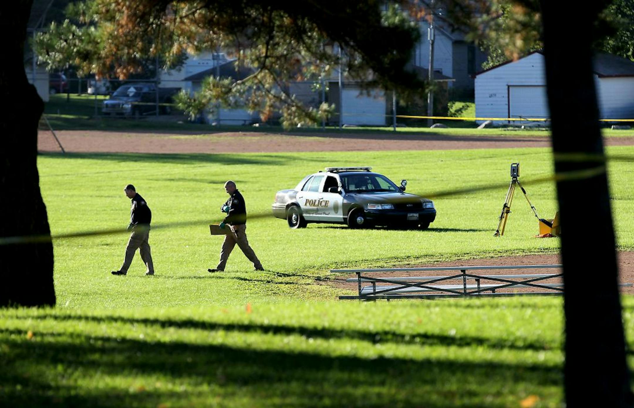 Police investigate the scene where a body was discovered in Hazel Park in St. Paul on Tuesday, September 29, 2015.