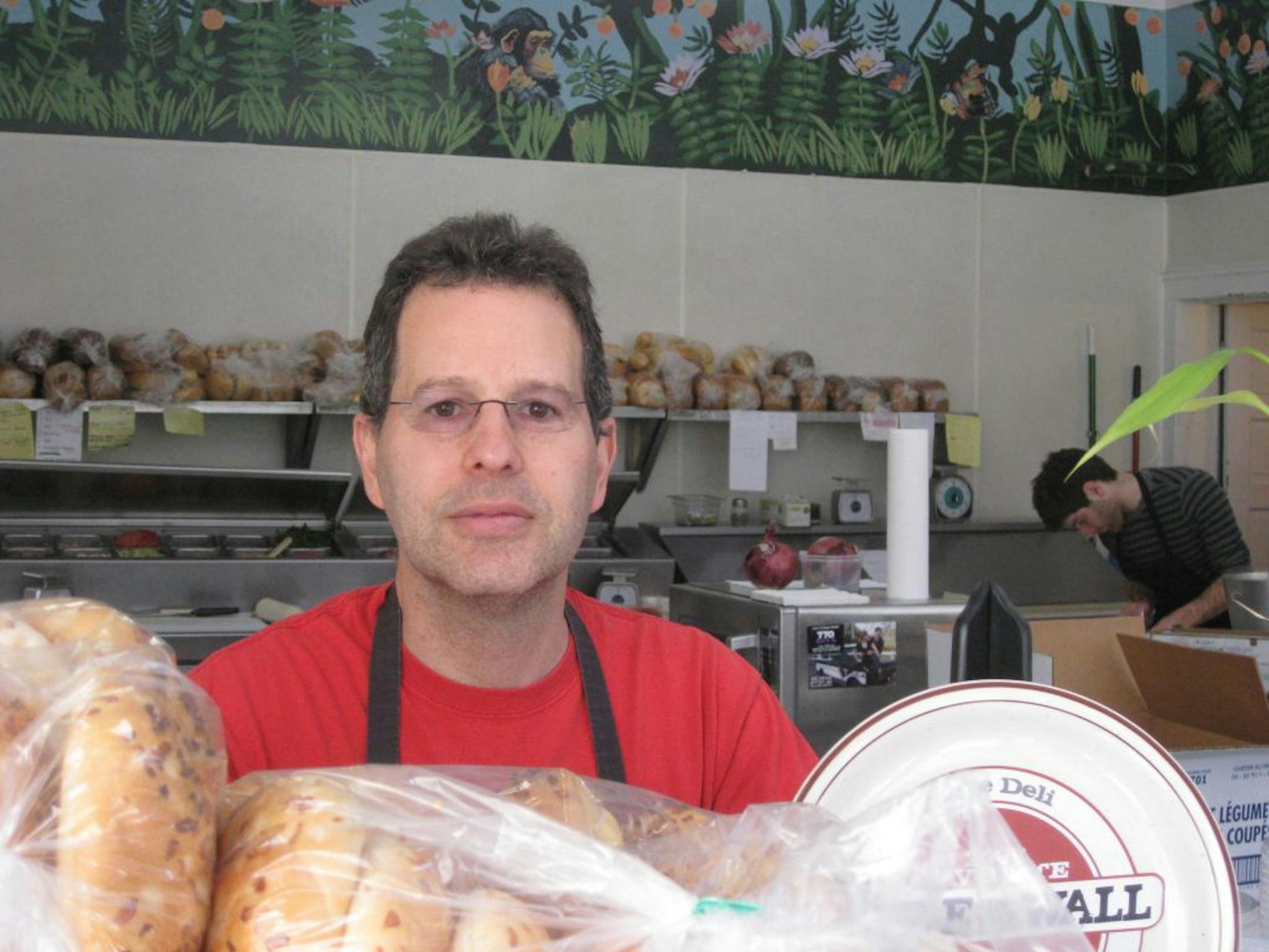 Jon Greer is selling his Acme Deli in St. Paul after 18 years to stay home with his newest daughter, an adoptee from an Ethiopian orphanage.