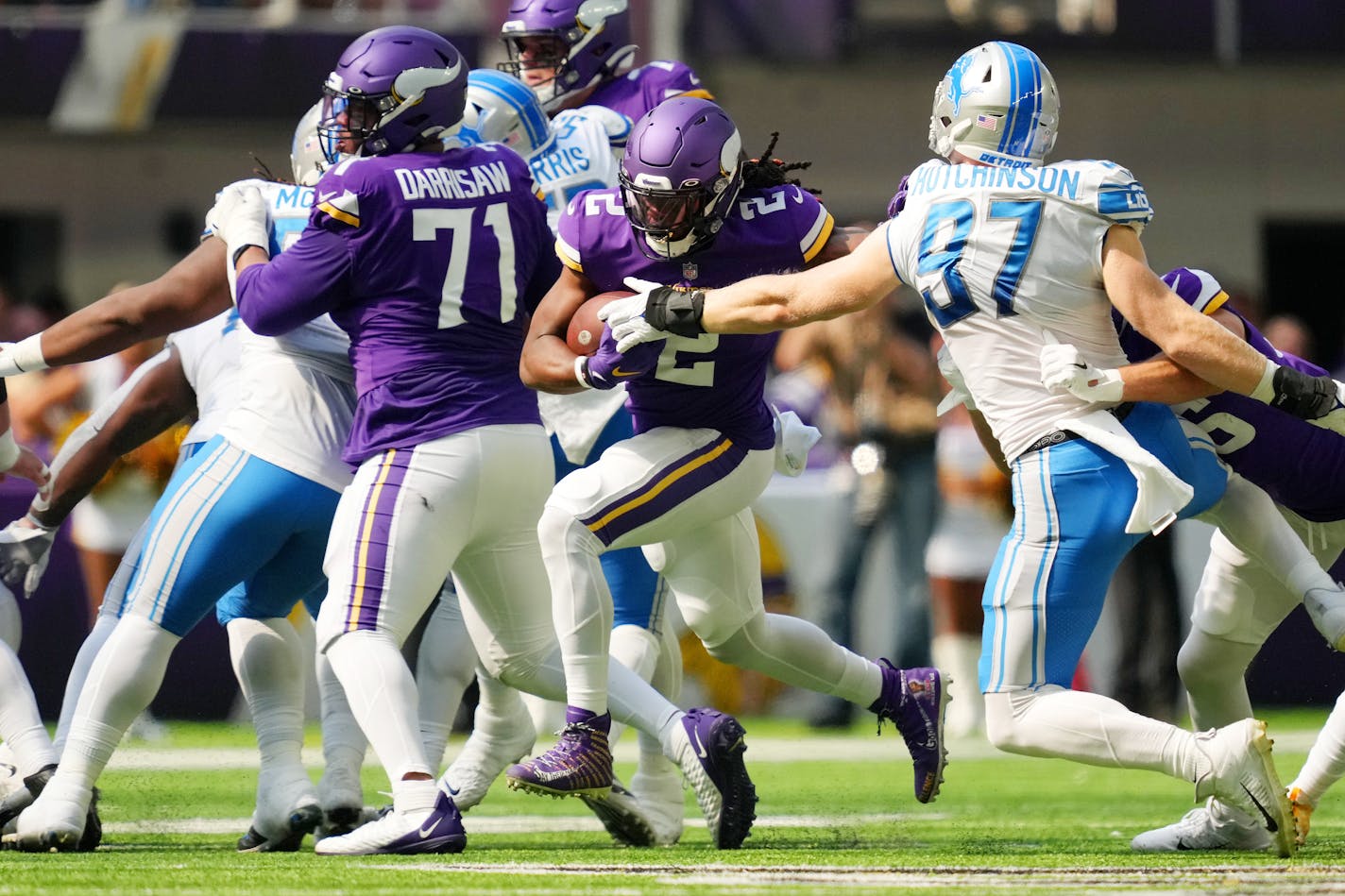 Minnesota Vikings running back Alexander Mattison (2) rushes the ball past Detroit Lions defensive end Aidan Hutchinson (97) in the second quarter of an NFL game between the Minnesota Vikings and the Detroit Lions Sunday, Sept. 25, 2022 at U.S. Bank Stadium in Minneapolis. ] ANTHONY SOUFFLE • anthony.souffle@startribune.com