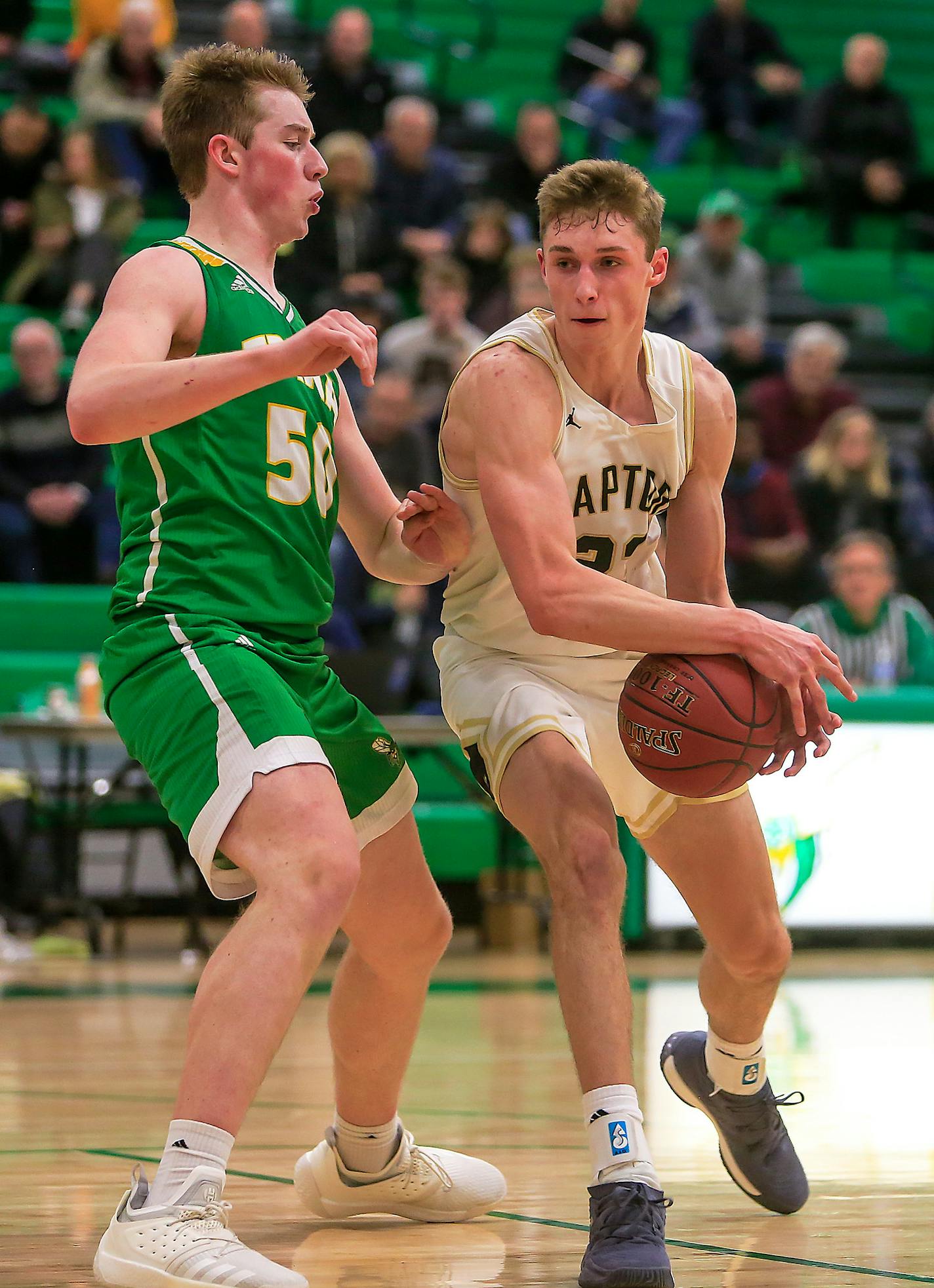 Ben Carlson, right, drives on Jacob Hutson. East Ridge at Edina, 2-1-19. Photo by Mark Hvidsten, SportsEngine