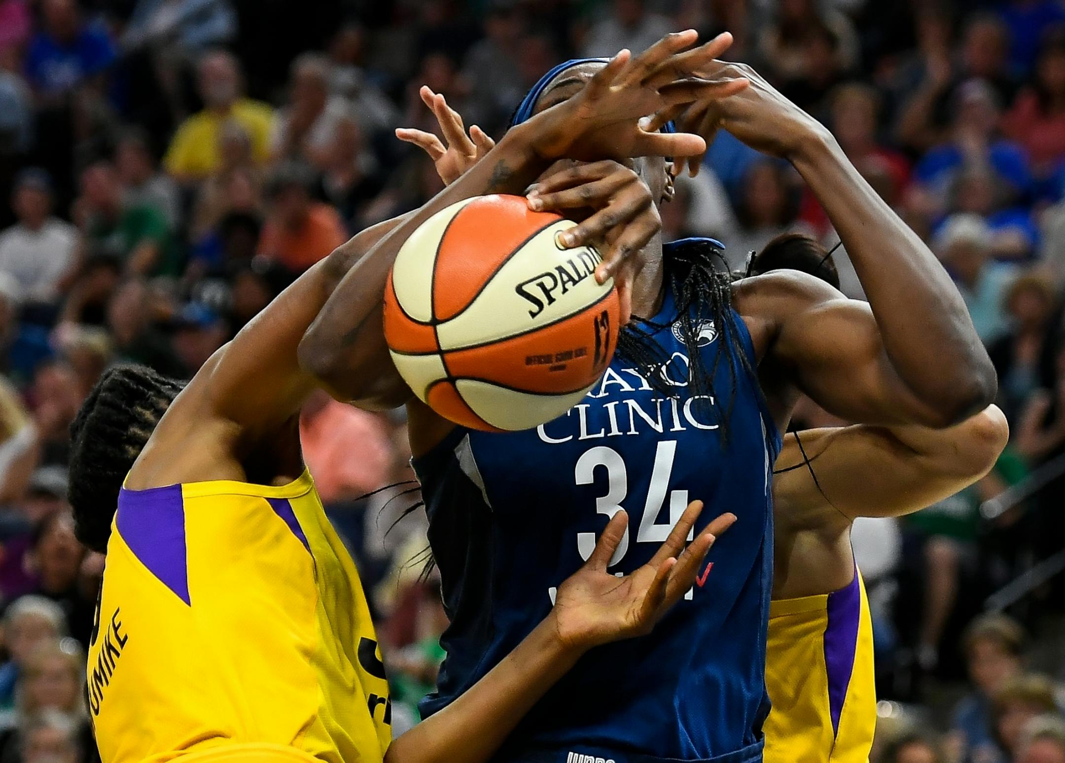 Los Angeles Sparks forward Nneka Ogwumike (30) and forward Candace Parker (3) got physical with Minnesota Lynx center Sylvia Fowles (34), but no foul was called, leading to an argument between Minnesota Lynx head coach Cheryl Reeve and and official, resulting in Reeve's ejection in the second half.