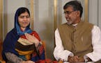 Joint-Nobel Peace prize winners Malala Yousafzai, left, and Kailash Satyarthi attend a press conference in Oslo, Norway, Tuesday, Dec. 9, 2014. The No