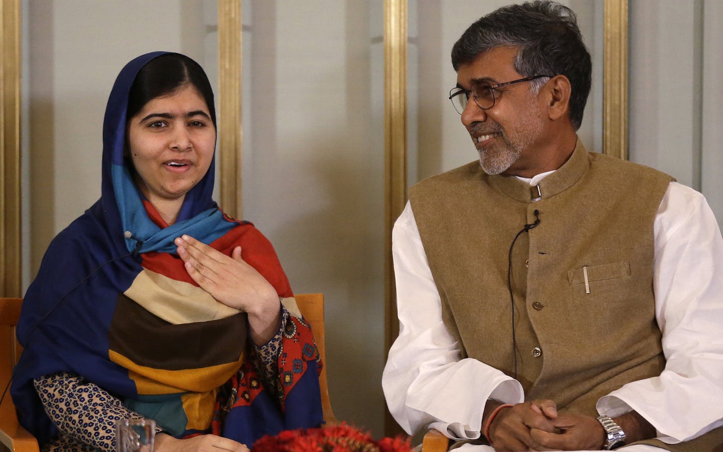 Joint-Nobel Peace prize winners Malala Yousafzai, left, and Kailash Satyarthi attend a press conference in Oslo, Norway, Tuesday, Dec. 9, 2014. The Nobel Peace Prize will be presented to and shared between the youngest Nobel Prize winner ever, 17-year-old Taliban attack survivor Malala Yousafzai and Indian children's rights activist Kailash Satyarthi in a ceremony in Oslo on Wednesday. (AP Photo/Matt Dunham) ORG XMIT: MIN2014120911214734