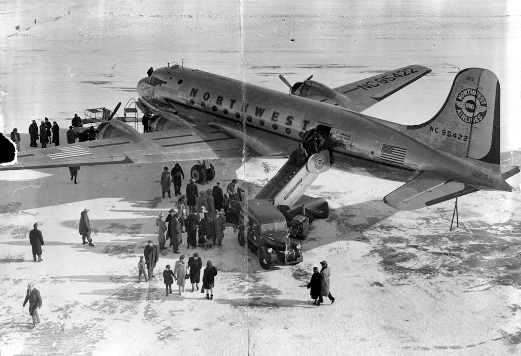 People prepare to board 'Trail Blazer,' a Douglas DC4 airplane, on Jan. 1, 1947. The flight to several countries in Asia was a survey of Northwest Airline's soon-to-be-established overseas route.