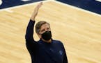 Minnesota Timberwolves head coach Chris Finch gestures against the Chicago Bulls in the fourth quarter during an NBA basketball game, Sunday, April 11