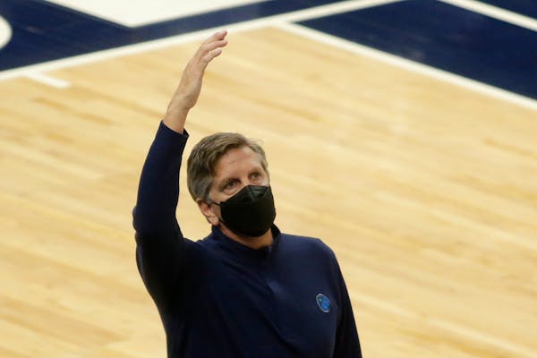 Minnesota Timberwolves head coach Chris Finch gestures against the Chicago Bulls in the fourth quarter during an NBA basketball game, Sunday, April 11