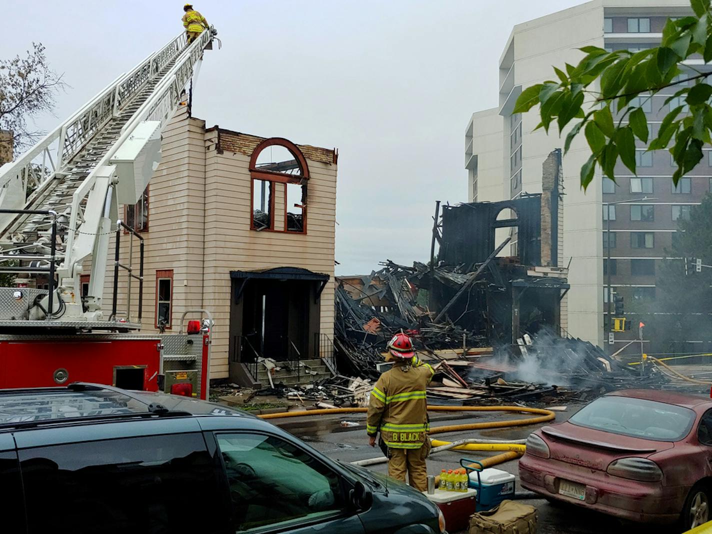 Firefighters work the scene of an overnight fire that engulfed and destroyed a synagogue in downtown Duluth, Minn., Monday, Sept. 9, 2019. (Brooks Johnson/Star Tribune via AP)