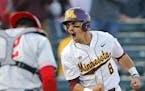 Minnesota's Micah Coffey (8) celebrates the go-ahead and eventual game-winning run on a past ball during the sixth inning against Ohio State at Sieber