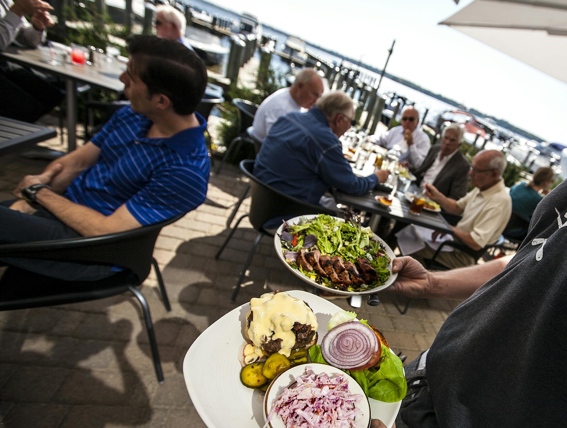 A Fat Burger, bottom, with coleslaw and the Bistro Steak Salad at 6smith in Wayzata September 25, 2014. (Courtney Perry)