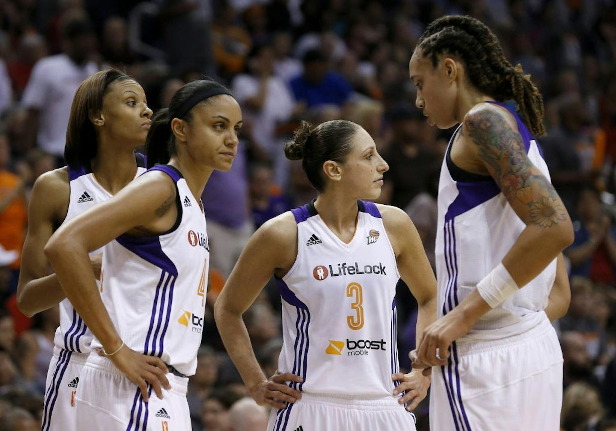 From left to right, Phoenix Mercury's DeWanna Bonner, Candice Dupree, Diana Taurasi, and Brittney Griner stand dejectedly on the court in the second half during a WNBA basketball game loss to the Chicago Sky on Monday, May 27, 2013, in Phoenix. The Sky defeated the Mercury 102-80.