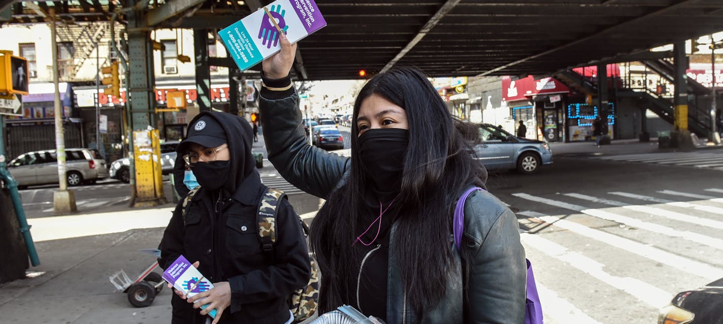 Handing out literature about domestic violence in the Bronx, on April 10, 2020. As the coronavirus forces people to stay home, reports of domestic violence are falling in New York City, alarming the authorities.(Stephanie Keith/The New York Times)