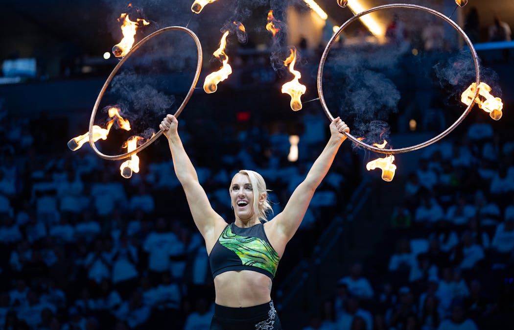 Grace Good, who first taught herself to spin hula hoops in her dorm quad at college, performs during halftime
of the an NBA playoffs game between the Timberwolves and Phoenix Suns at Target Center on April 20.