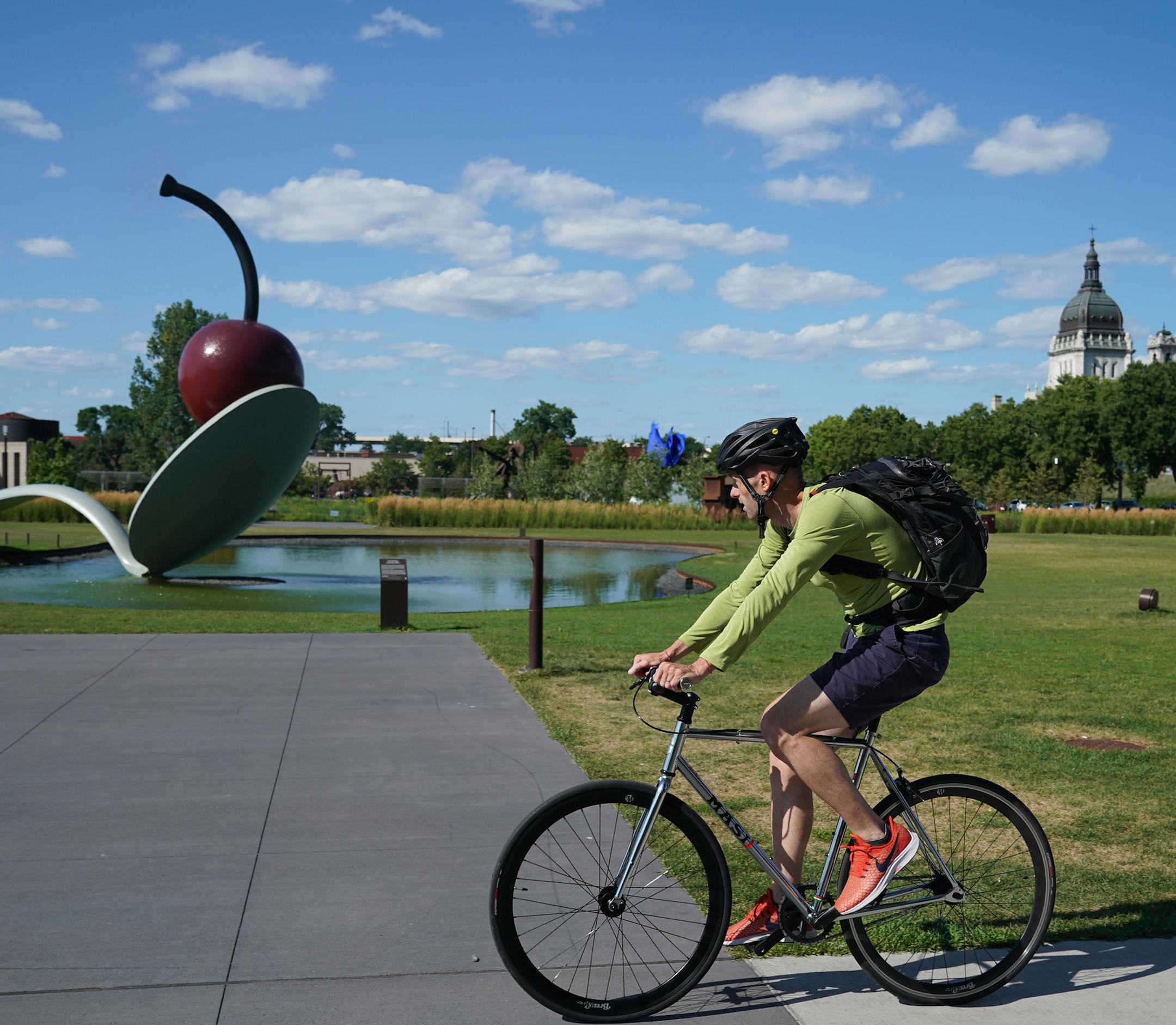 Bicyclists rode through the Minneapolis Sculpture Garden on Thursday, August 8, 2019. With Southwest Light Rail Construction, bikers that typically commute to work in and out of the cities have been forced off of bike trails (like Cedar Lake) and into spots where they generally wouldn't be, like Loring Park or the Minneapolis Sculpture Garden. ] Shari L. Gross • shari.gross@startribune.com With Southwest Light Rail Construction, bikers that typically commute to work in and out of the citi