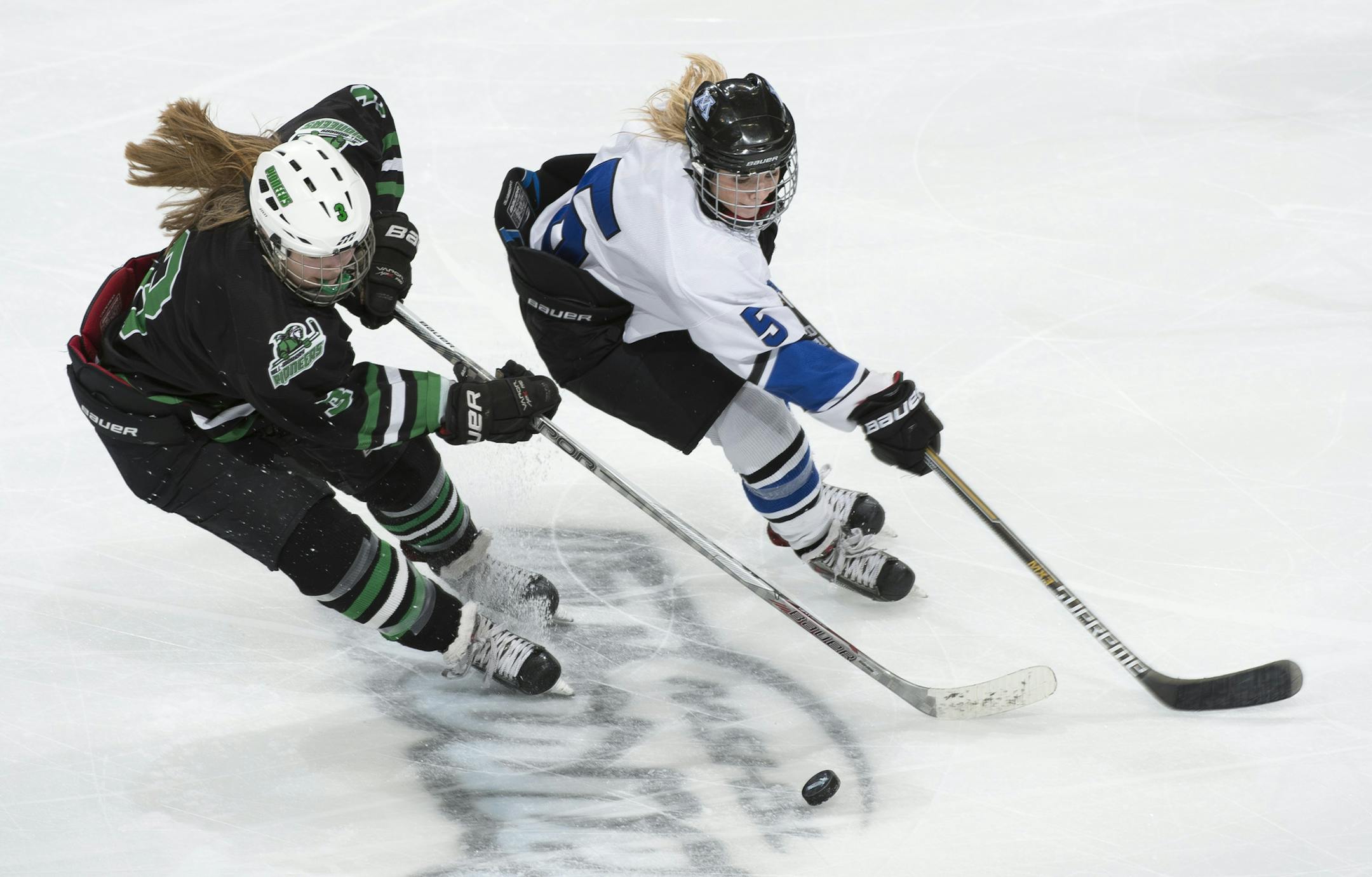 Hill-Murray forward Laura Anderson (3) and Minnetonka forward Presley Norby (5) chase down the puck during the third period on Saturday. ] (Aaron Lavinsky | StarTribune) Hill-Murray plays Minnetonka in the Class 2A Girls' Hockey Championship game on Saturday, Feb. 21, 2015 at Xcel Energy Center in St. Paul.