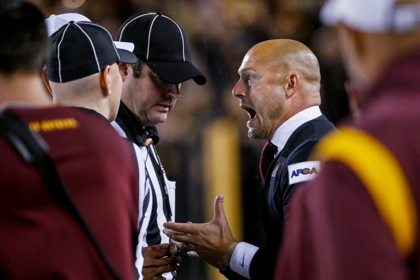 Minnesota coach P.J. Fleck pleads with officials on a review of a call that gave the ball to Ohio State after a Minnesota reception and fumble during the fourth quarter of an NCAA college football game Thursday, Sept. 2, 2021, in Minneapolis. Ohio State won 45-31. (AP Photo/Bruce Kluckhohn)