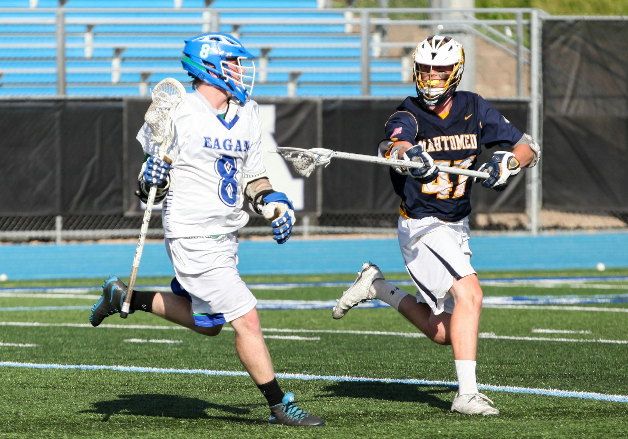 Mahtomedi Ethan Hamme (47) checked Eagan Brandon Wuertz (8) in the second quarter . ] XAVIER WANG • xavier.wtian@gmail.com Game action from the 2017 Boys and Girls State Lacrosse Tournament Boys' semifinals game between Eagan and Mahtomedi on Thursday June 15, 2017 at Minnetonka High School in Minnetonka.