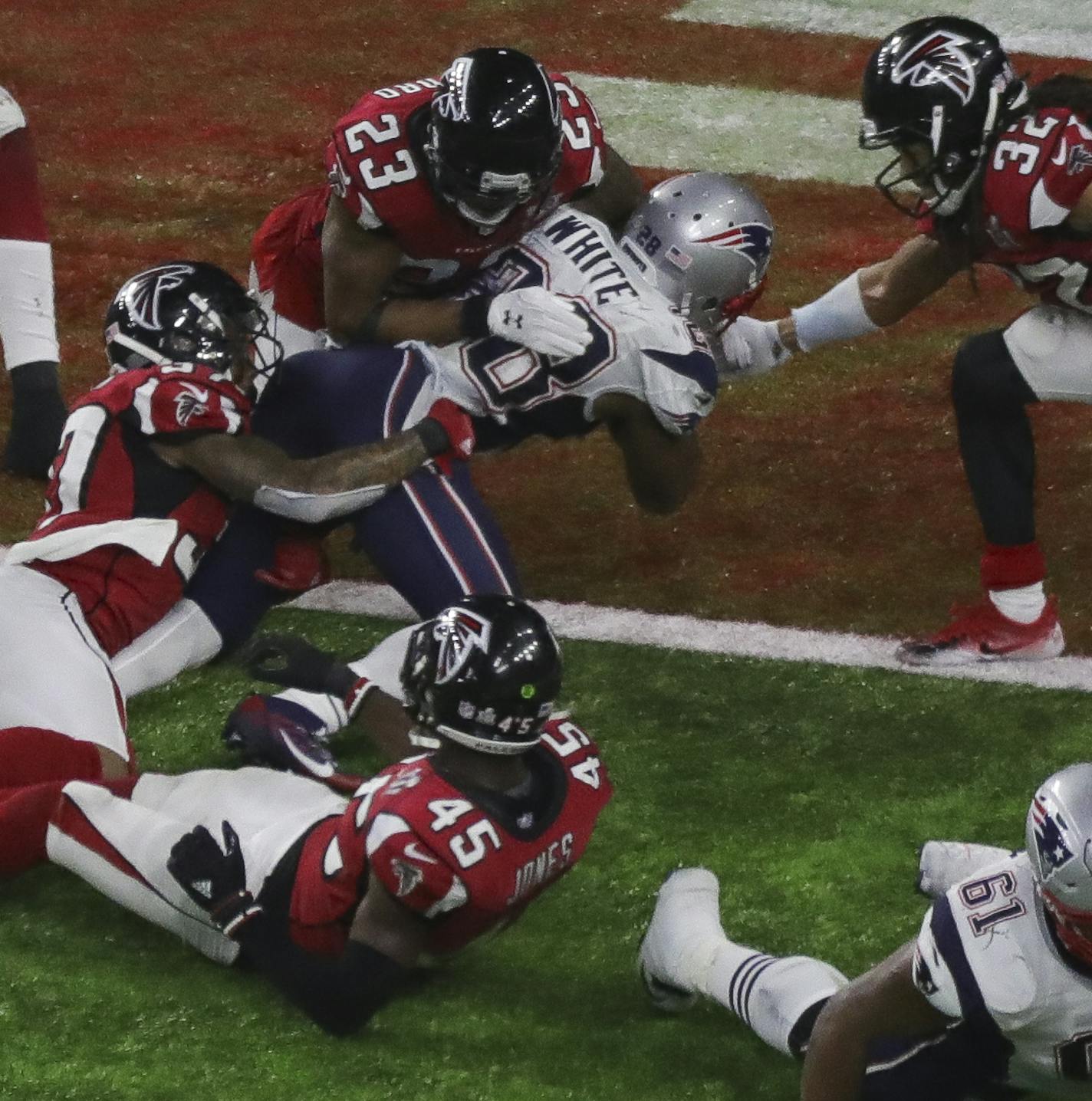 New England Patriots running back James White (28) carries the ball for the game winning touchdown during an NFL Super Bowl LI football game against the Atlanta Falcons on Sunday, Feb. 5, 2017 in Houston. New England won 34-28 in overtime. (Peter Read Miller via AP) ORG XMIT: NYWWP