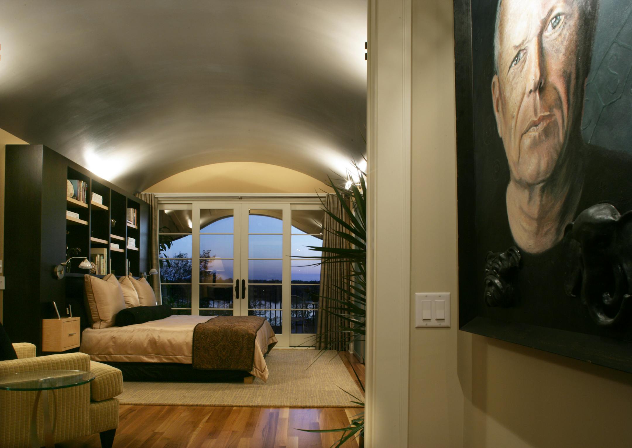 Owner's suite: Inspired by The Kimbell Art Museum in Fort Worth, Texas, by architect Louis Kahn. "He took traditional forms and interpreted them in a modern way," said designer Bonnie Birnbaum, who collaborated with Kimberly Herrick. The traditional barrel-vaulted ceiling got a modern silver paint treatment. Design tip: Textured vertical-striped wallpaper was hung horizontally to create a novel effect.