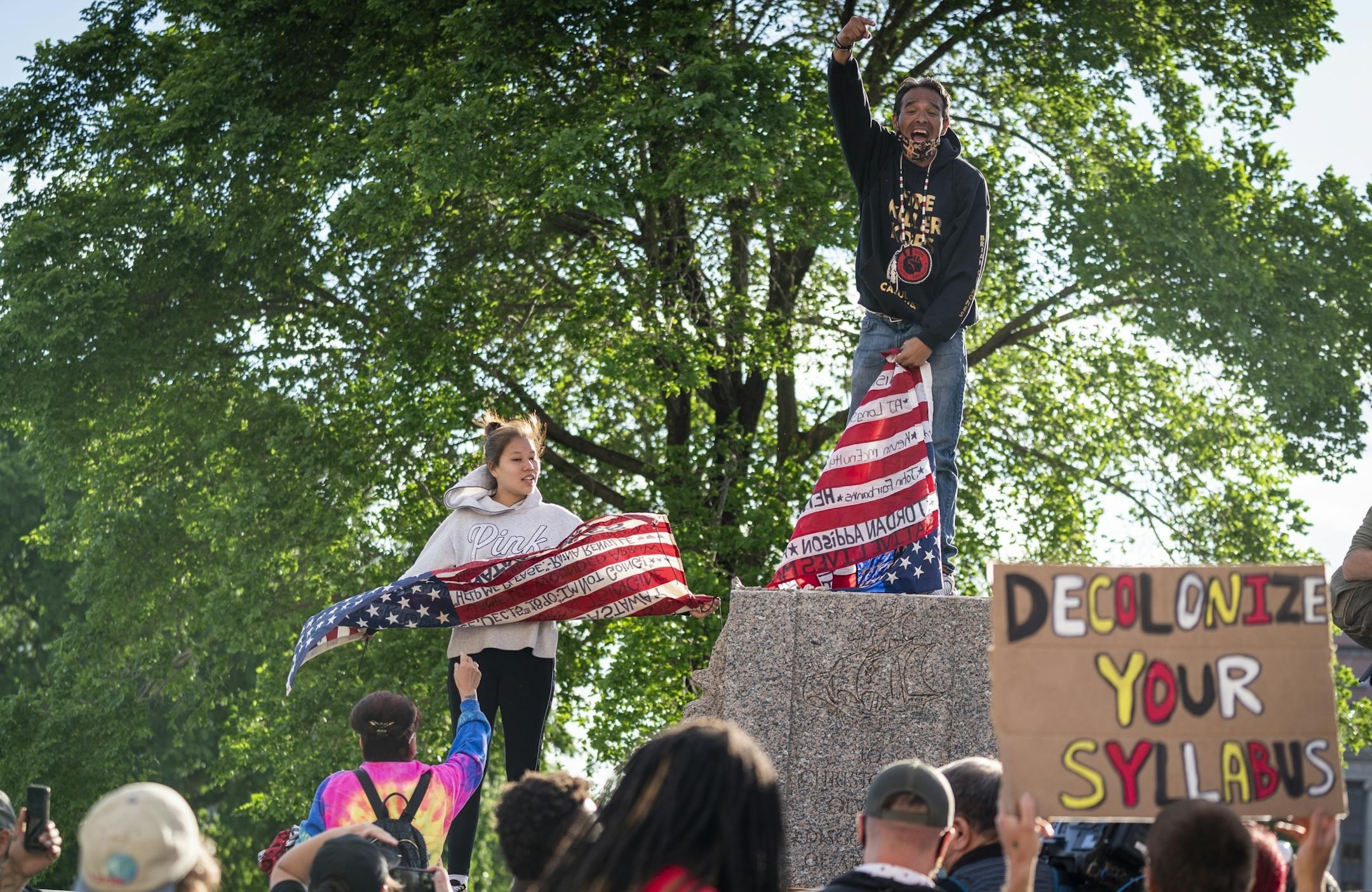 Gabriel Black Elk, of Native Lives Matter stood where the Christopher Columbus statue once stood with his daughter Shelby Black Elk.