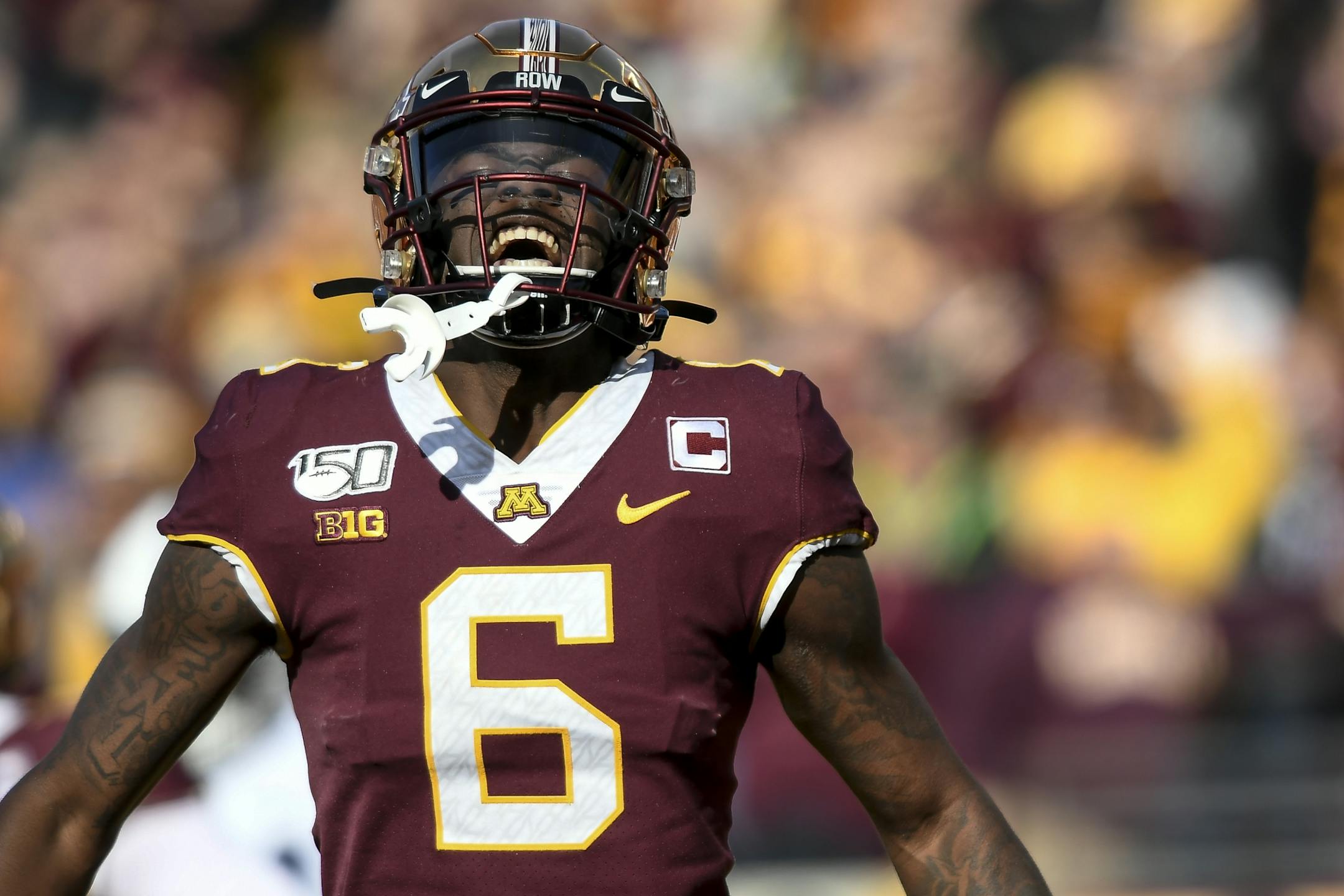 Minnesota Gophers wide receiver Tyler Johnson (6) celebrated a touchdown by wide receiver Chris Autman-Bell (7) in the first half.