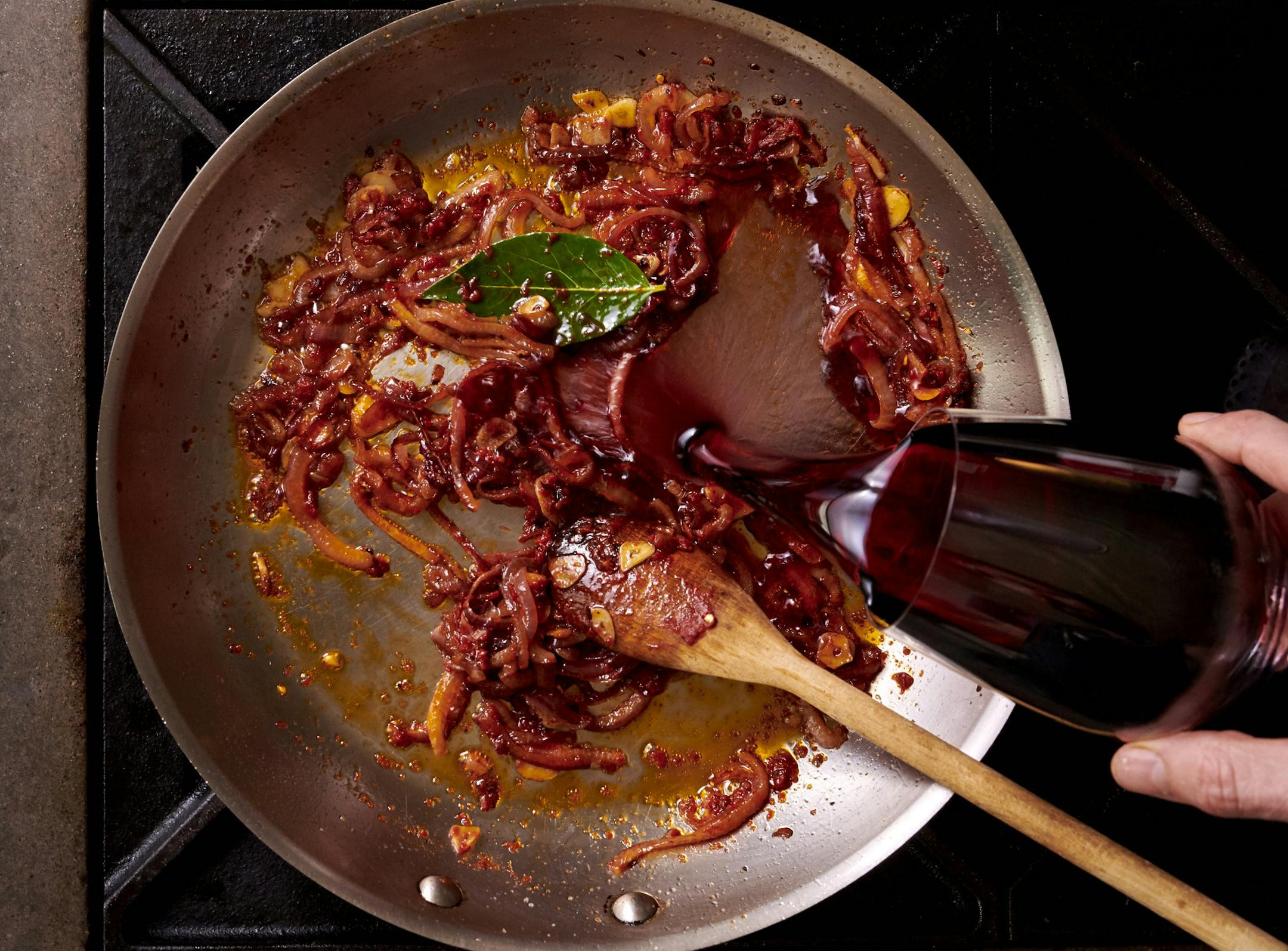 A cup of wine goes into the cooking water to make red wine spaghetti, in New York, February 2019. An entire bottle of red wine &#x2014; some in the cooking water, the rest for the rich, ruddy sauce &#x2014; goes into this hearty, impromptu meal. Food Styled by Simon Andrews. (David Malosh/The New York Times) ORG XMIT: XNYT68