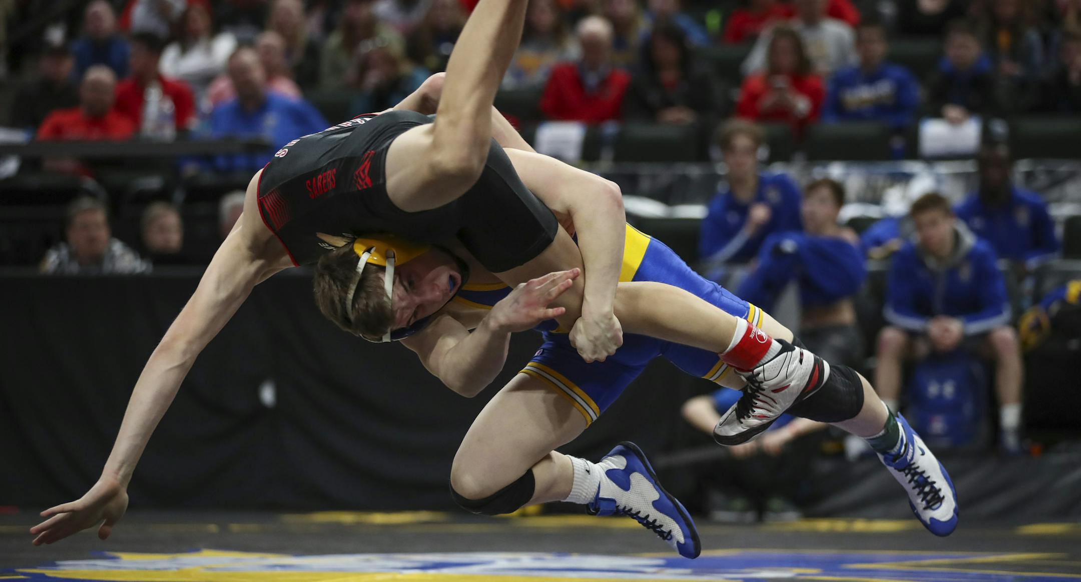 St. Michael-Albertville's made a move on Shakopee's during their 113lb. match in Class 3A competition. St. Michael-Albertville's won 9-5. ] JEFF WHEELER ï jeff.wheeler@startribune.com The State High School Wrestling Tournament team competition Championship took place Thursday night, March 1, 2018 at Xcel Energy Center in St. Paul.