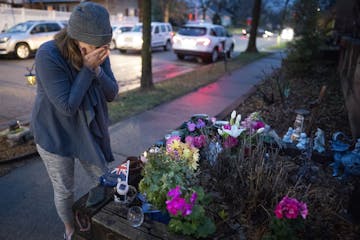 Rene Norton, a friend and neighbor of Justine Ruszczyk Damond, wiped away tears after leaving flowers on her memorial. "I'm so glad that there's justi