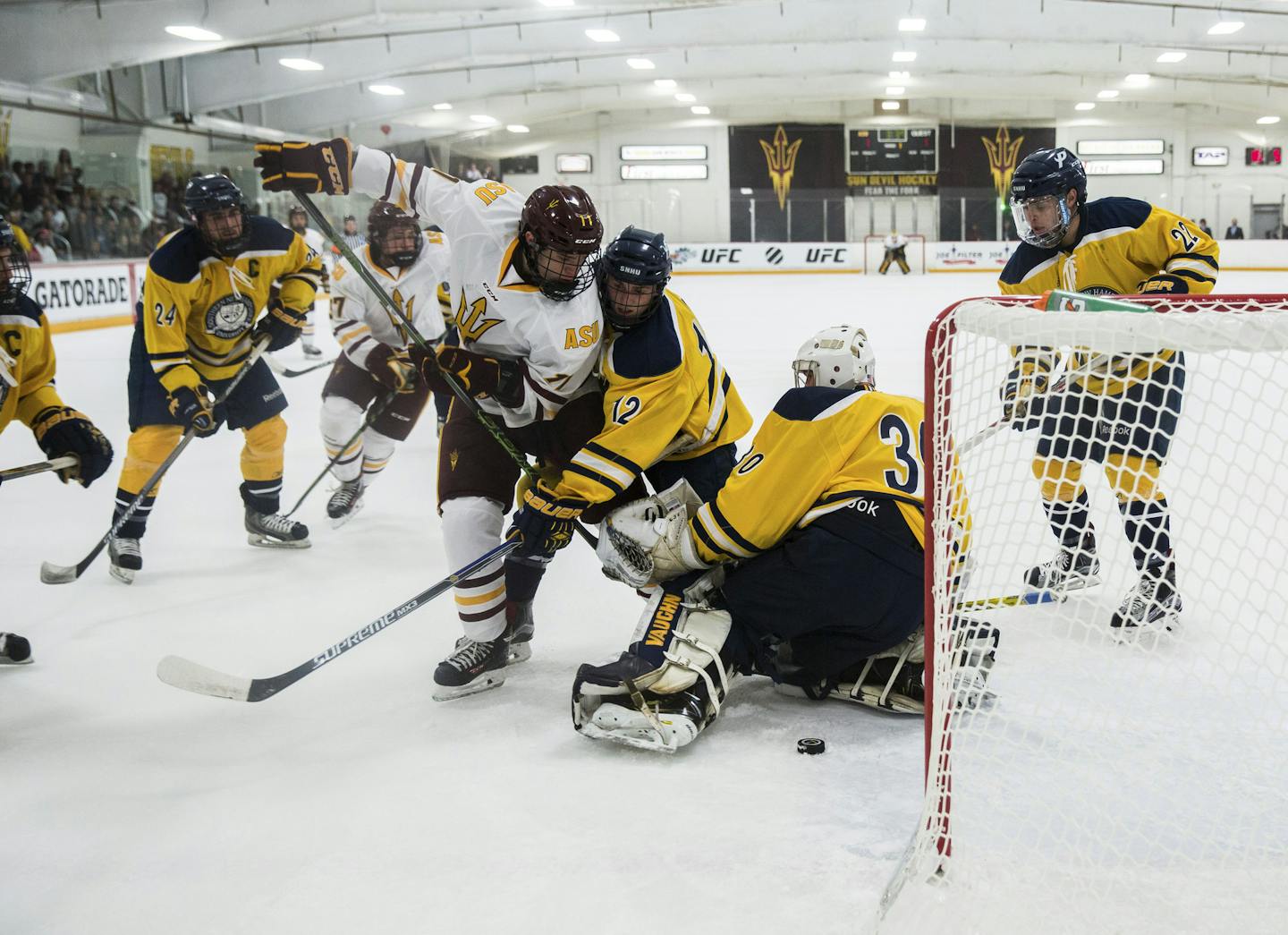 Arizona State freshman forward Jack Rowe scores in a home game against Southern New Hampshire at Oceanside Ice Arena in Tempe, Ariz., Oct. 23, 2015. The Sun Devils, one of two teams at the top level of collegiate hockey in the southern United States, is accumulating experience and a lot of travel miles. (Deanna Alejandra Dent/The New York Times)