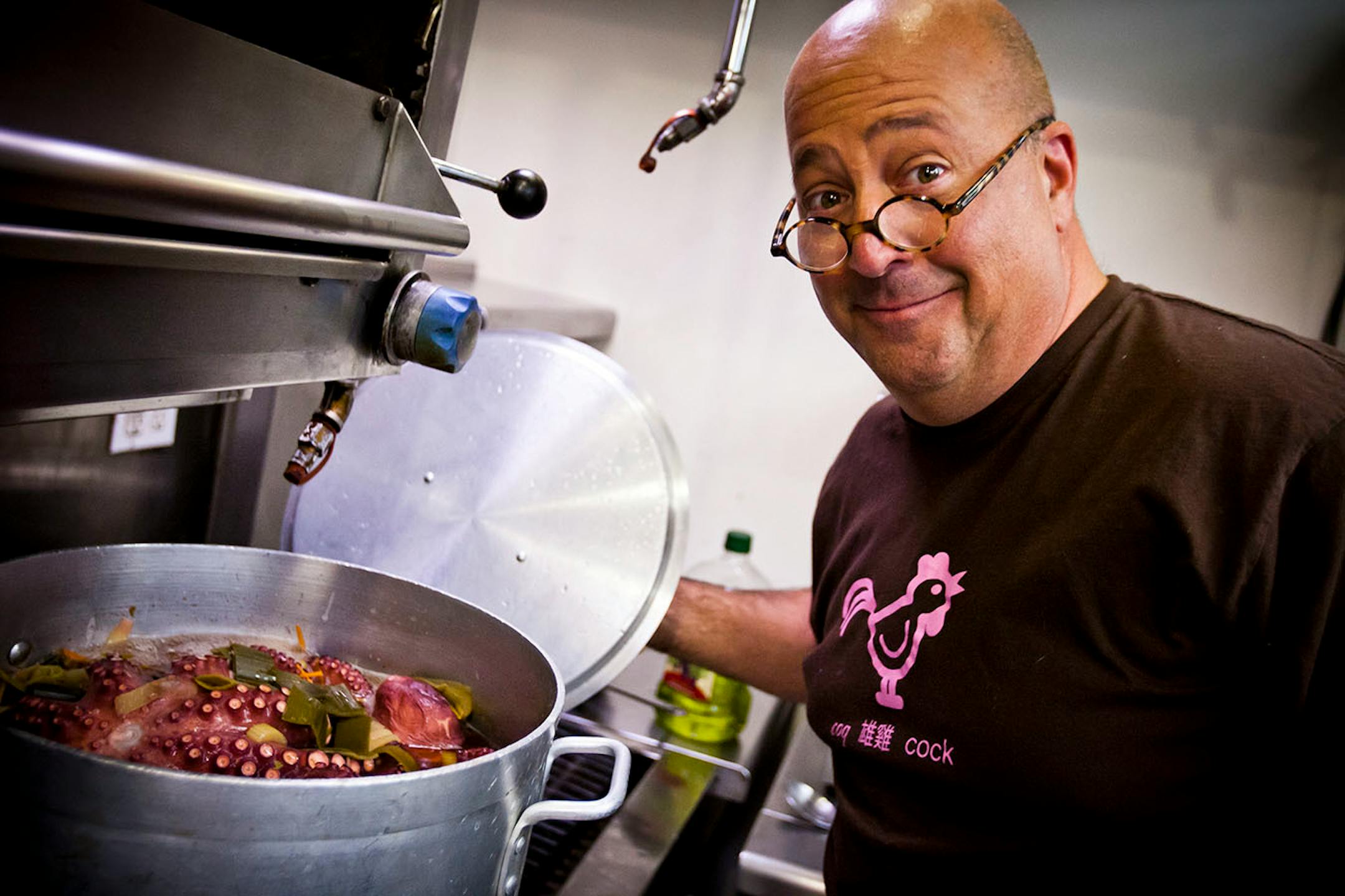 Bizarre Foods host and Chef Andrew Zimmern checks on his Spanish braised octopus dish as he prepares for a pop-up dinner for an episode of the upcoming season, Thursday, Jan. 12, 2012, at the Crown T in Culver City, California.