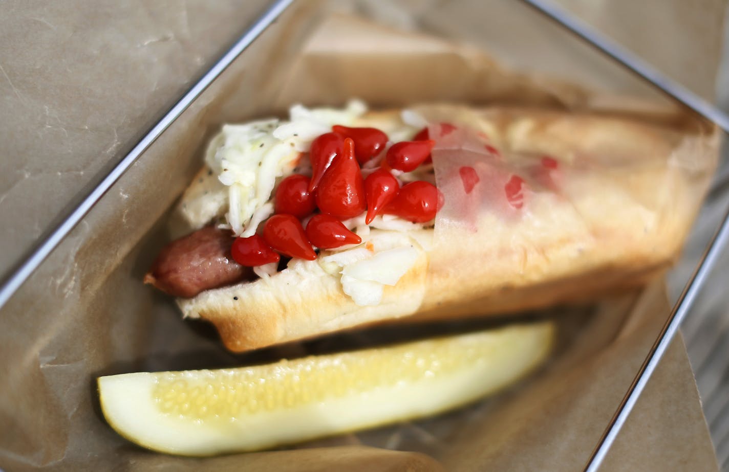 Restaurant review: Sandcastle at Lake Nokomis - The signiture Nokomis Dog with slaw and sweet pepper. ] BRIAN PETERSON &#x201a;&#xc4;&#xa2; brianp@startribune.com Minneapolis, MN - 08/03//2013