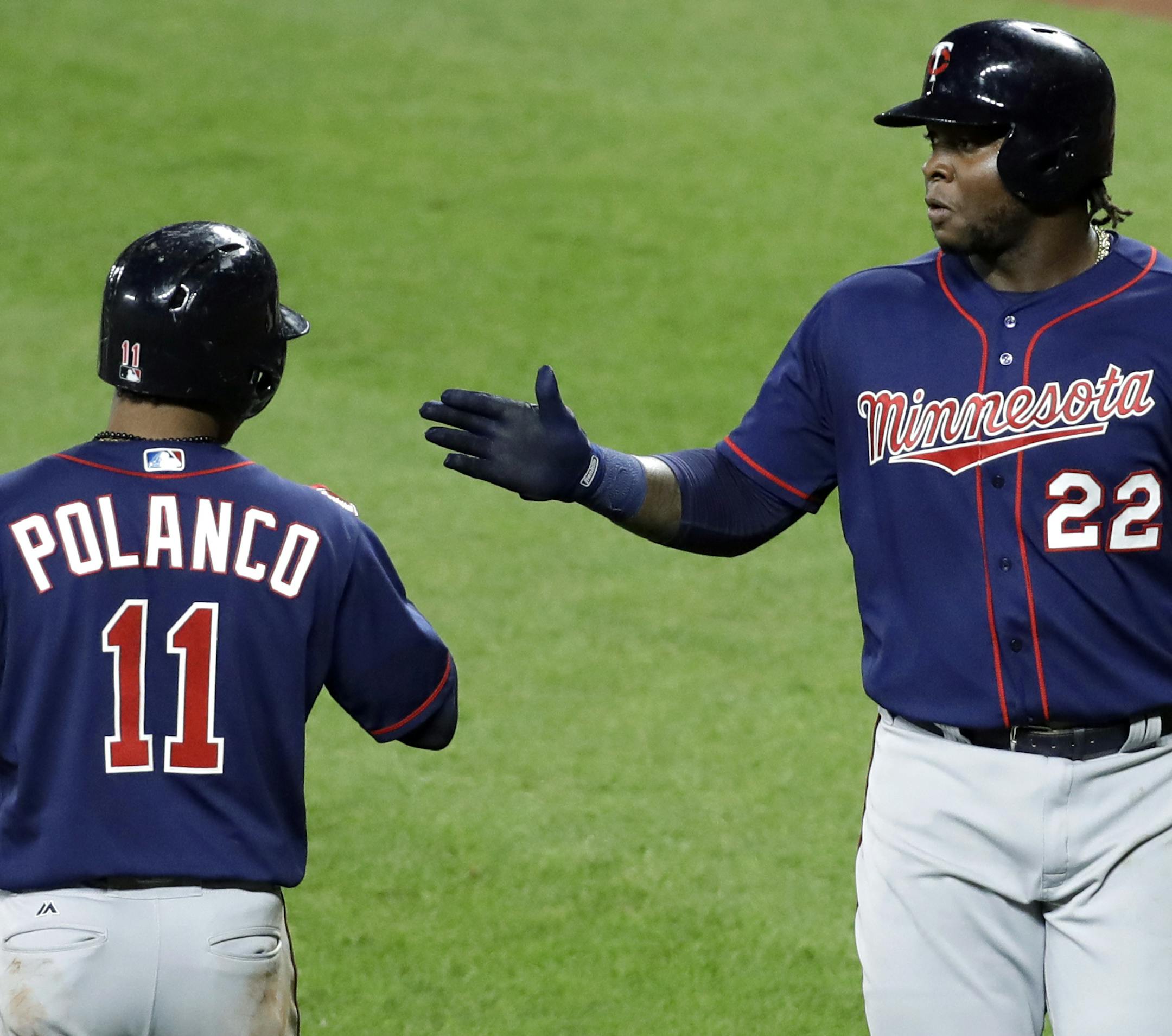 The Twins&#x2019; Miguel Sano, right, high-fived teammate Jorge Polanco after scoring on a sacrifice fly hit by Eduardo Escobar in the fifth inning against the Orioles on Monday.