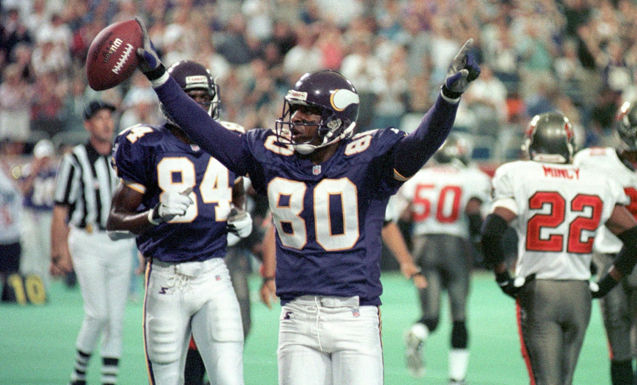 Minnesota Vikings wide receiver Cris Carter (80) celebrates after scoring on a 1-yard pass from Brad Johnson in the first quarter against the Tampa Bay Buccaneers Sunday, Sept. 6, 1998, in Minneapolis. The Vikings beat the Buccaneers 31-7. (AP Photo/Tom Olmscheid) ORG XMIT: MIN2013080318304775