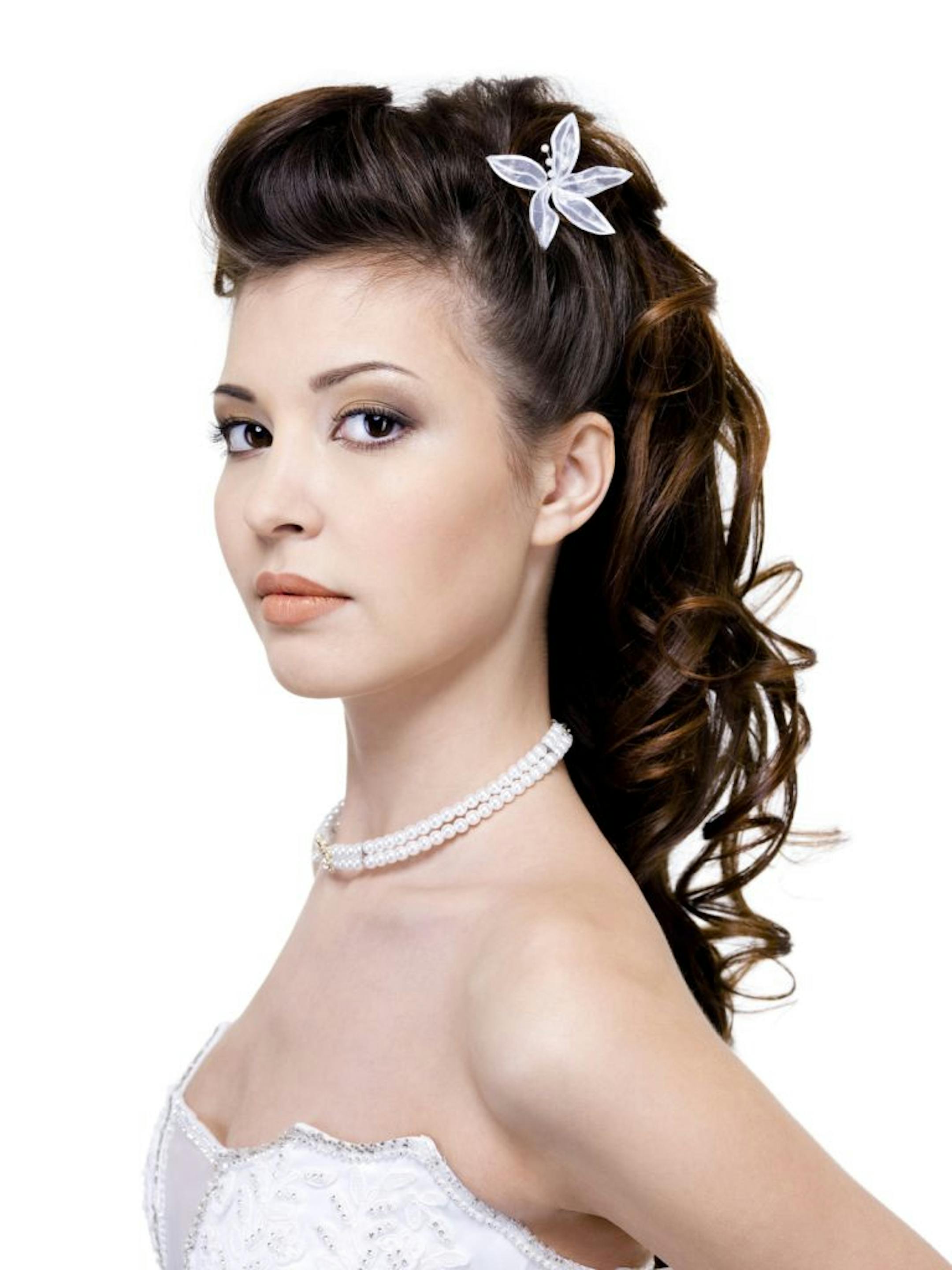 Atractive young woman with beautiful wedding hairstyle - isolated on white