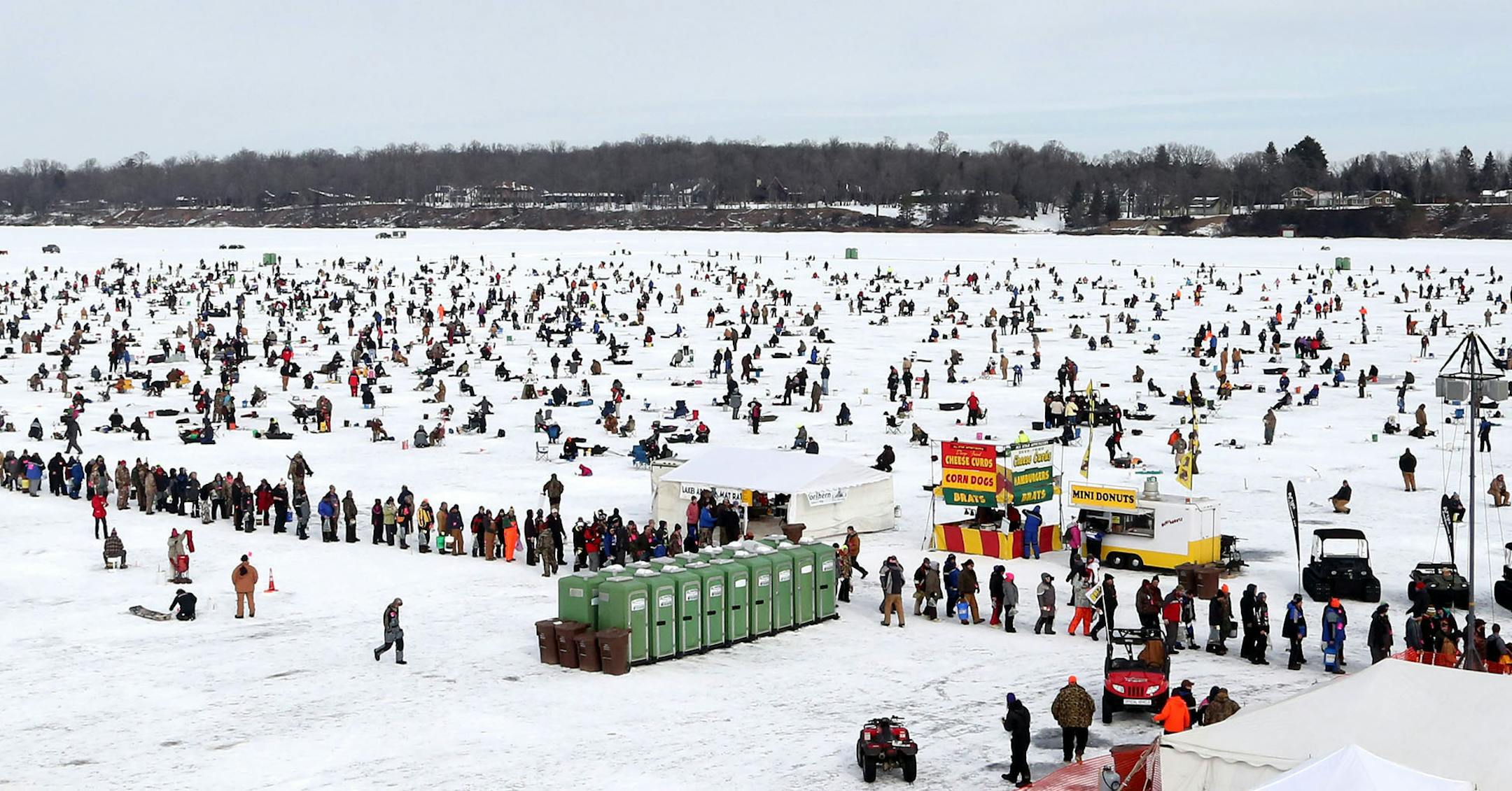 What appears as a long long for the portable bathrooms is actually a line of successful fishing contestants waiting to register their fish on Hole in the Day Bay of Gull Lake during the Ice Fishing Extravaganza Saturday, Feb. 6, 2016, in Brainerd, MN.](DAVID JOLES/STARTRIBUNE)djoles@startribune.com About 10,000 ice fishing contestants were expected to headed to Gull Lake north of Brainerd for the Brainerd Jaycees 26th Annual $150,000 Ice Fishing Extravaganza.