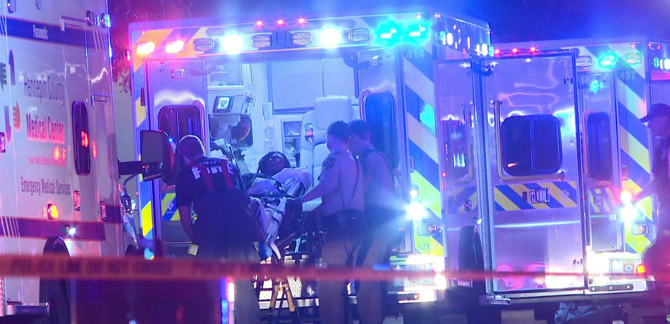 In this photo provided by KARE, a person is brought into an emergency vehicle after a shooting early Monday, Oct. 3, 2016, in Minneapolis. Minneapolis police said multiple people have been wounded in shootings in downtown Minneapolis. (KARE via AP) ORG XMIT: MIN2016100514453356