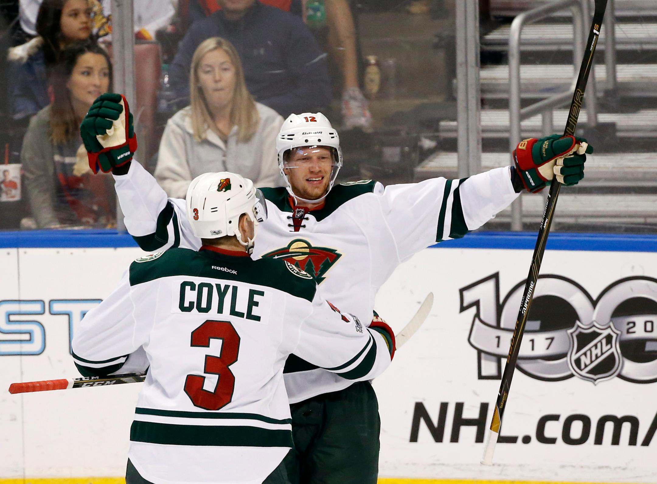 Minnesota Wild center Charlie Coyle (3) celebrated with center Eric Staal after Staal scored during the third period of an NHL hockey game against the Florida Panthers, Friday, March 10, 2017, in Sunrise, Fla.